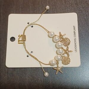 Stunning Gold and Pearl Starfish Charm Bracelet